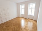 Whg 1070:2_Wohnzimmer 1070 Wien Neubau Altbau Stil Luxus Fischgrät Parkett Wohntraum